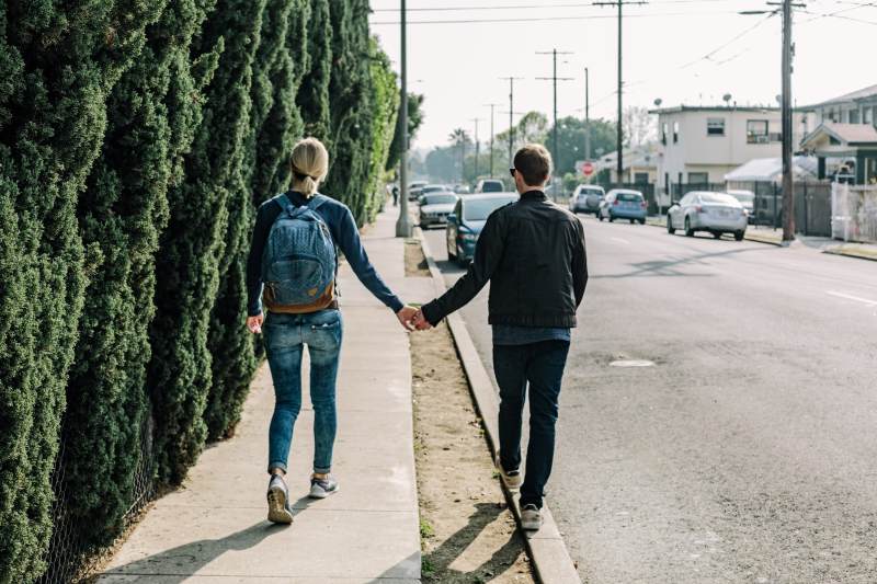 Couple walking holding hands